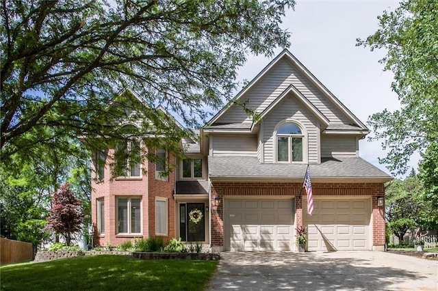 4837 W 121st St, Overland Park, KS 66209 - view of front facade featuring an attached garage, concrete driveway, a front yard, and brick siding