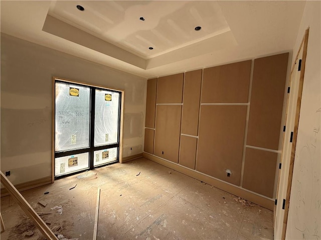 7410 NW Pampas Ln, Parkville, MO 64152 - spare room featuring a raised ceiling