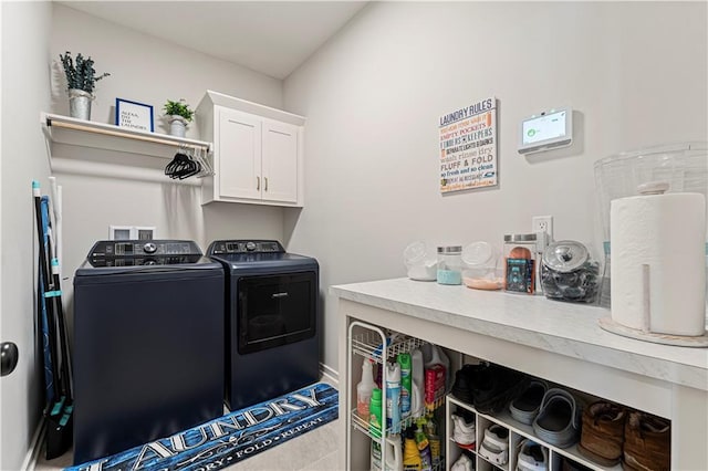 laundry area featuring cabinet space and washer and clothes dryer