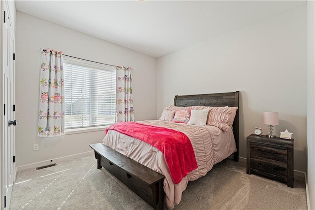 bedroom featuring carpet flooring, baseboards, and visible vents