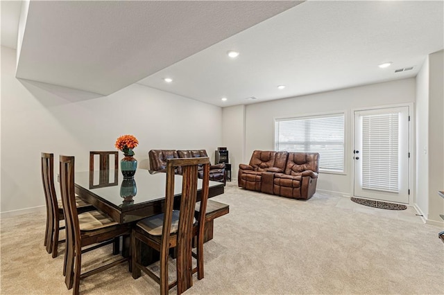 dining room featuring baseboards, recessed lighting, visible vents, and light carpet