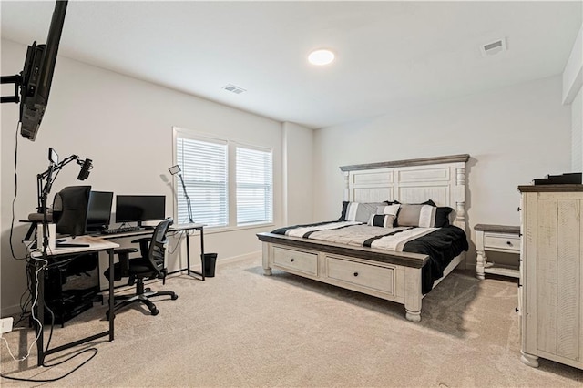 bedroom with light colored carpet, visible vents, and baseboards