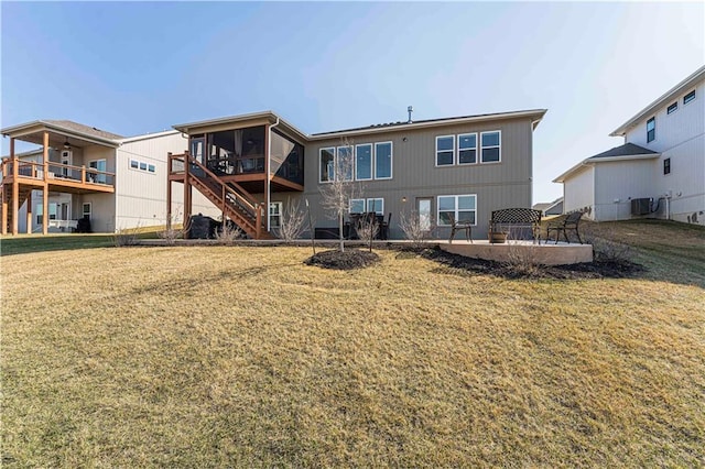 back of house with stairway, a yard, a patio area, and cooling unit