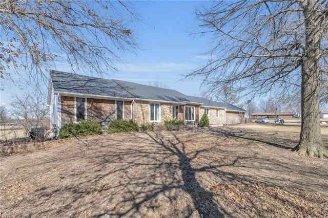 ranch-style house featuring a garage