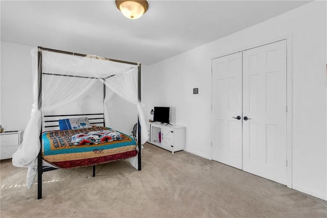 carpeted bedroom featuring a closet