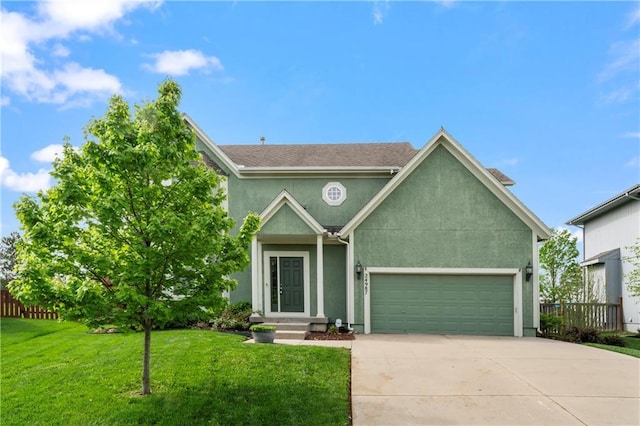 24987 W 150th Ct, Olathe, KS 66061 - view of front of property featuring an attached garage, stucco siding, fence, concrete driveway, and a front lawn