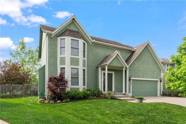 24987 W 150th Ct, Olathe, KS 66061 - view of front of property featuring fence, stucco siding, a front lawn, and concrete driveway
