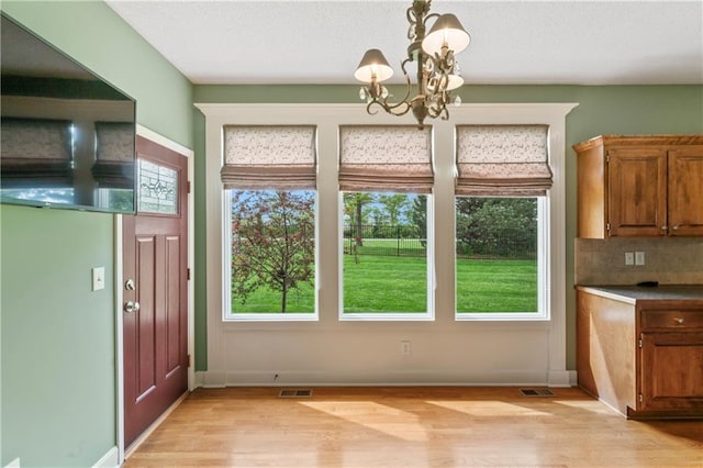 24987 W 150th Ct, Olathe, KS 66061 - interior space featuring light wood finished floors, baseboards, and a chandelier