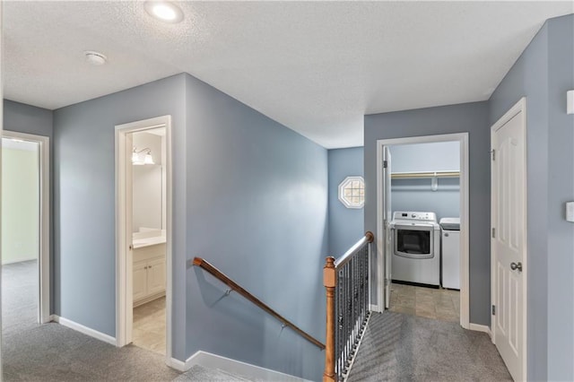 24987 W 150th Ct, Olathe, KS 66061 - corridor featuring washing machine and clothes dryer, carpet floors, and an upstairs landing