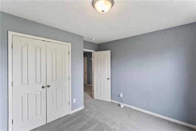 24987 W 150th Ct, Olathe, KS 66061 - unfurnished bedroom featuring carpet, a textured ceiling, a closet, and baseboards