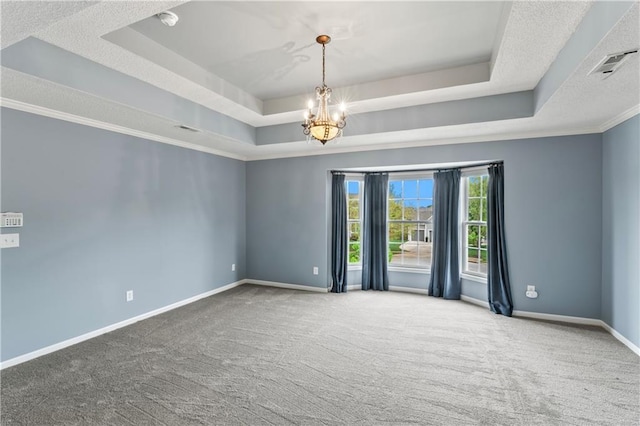 24987 W 150th Ct, Olathe, KS 66061 - carpeted empty room featuring a tray ceiling, visible vents, baseboards, and a chandelier