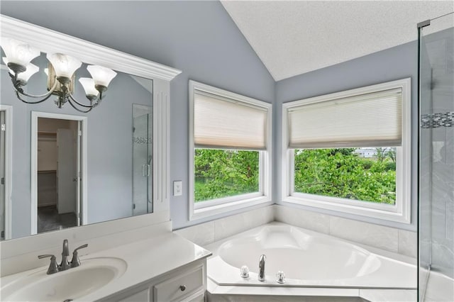 24987 W 150th Ct, Olathe, KS 66061 - full bathroom with lofted ceiling, a notable chandelier, a garden tub, and a shower stall