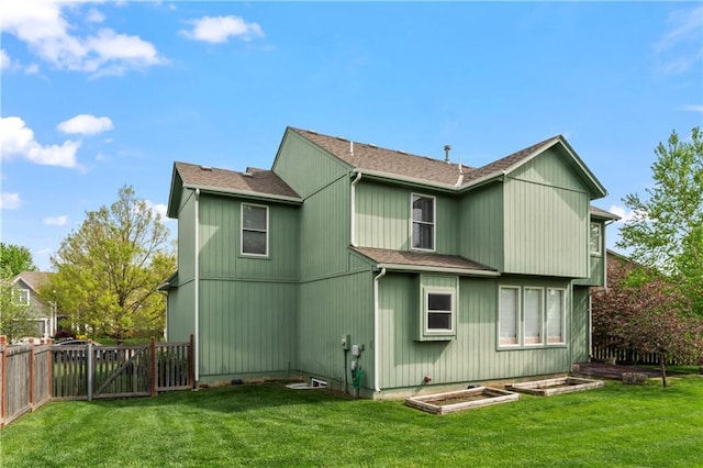 24987 W 150th Ct, Olathe, KS 66061 - back of house featuring roof with shingles, fence, and a lawn