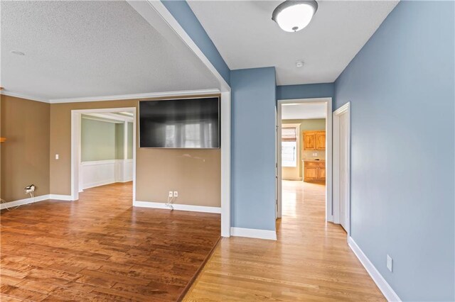24987 W 150th Ct, Olathe, KS 66061 - spare room featuring light wood-style flooring and baseboards