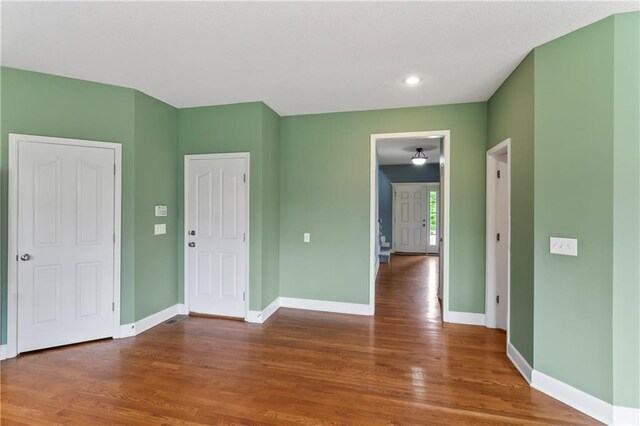 24987 W 150th Ct, Olathe, KS 66061 - unfurnished bedroom with wood finished floors and recessed lighting