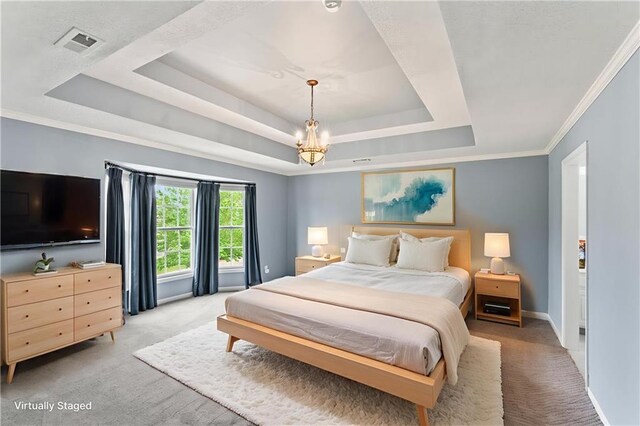 24987 W 150th Ct, Olathe, KS 66061 - bedroom featuring a tray ceiling, light colored carpet, a chandelier, baseboards, and crown molding