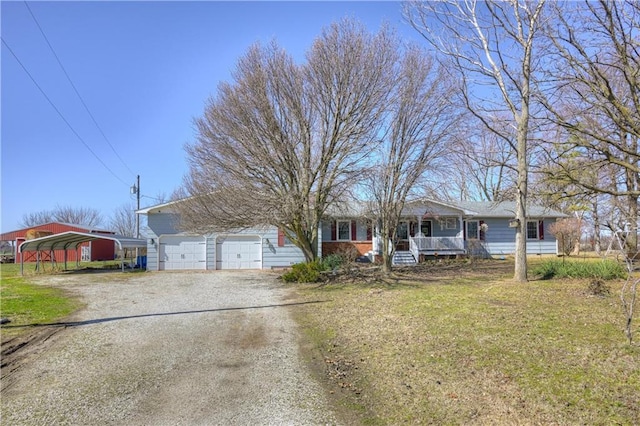 single story home featuring covered porch, a front lawn, and dirt driveway