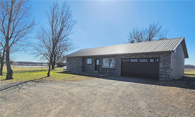 25237 NW Barton Rd, Westphalia, KS 66093 - single story home featuring a garage, driveway, stone siding, and metal roof