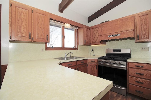 25237 NW Barton Rd, Westphalia, KS 66093 - kitchen with lofted ceiling with beams, stainless steel range with gas cooktop, light countertops, a sink, and dark wood finished floors