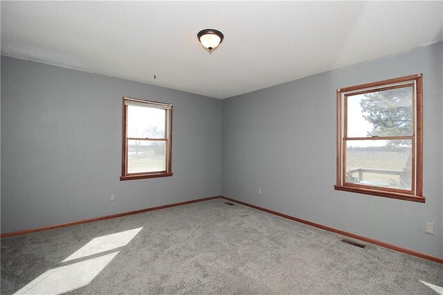 25237 NW Barton Rd, Westphalia, KS 66093 - empty room featuring carpet floors, baseboards, and visible vents