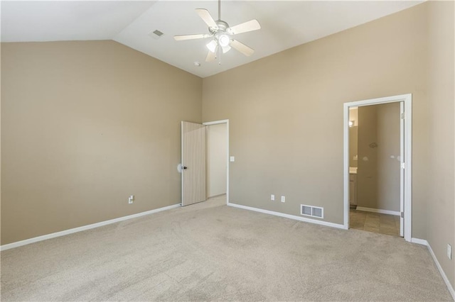 spare room with visible vents, baseboards, light colored carpet, and ceiling fan