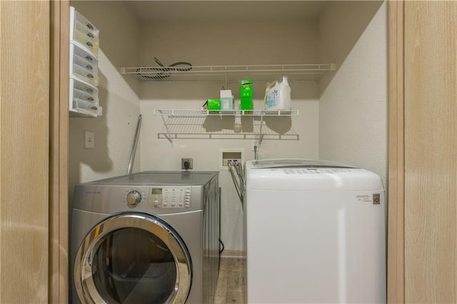 laundry room featuring washer and dryer and laundry area