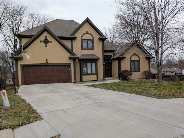 7730 N Shannon Ave, Kansas City, MO 64152 - view of front of home featuring stucco siding, concrete driveway, a garage, and roof with shingles