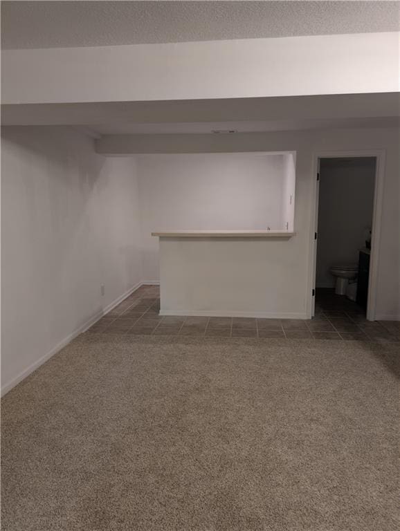 7730 N Shannon Ave, Kansas City, MO 64152 - below grade area with carpet flooring and baseboards