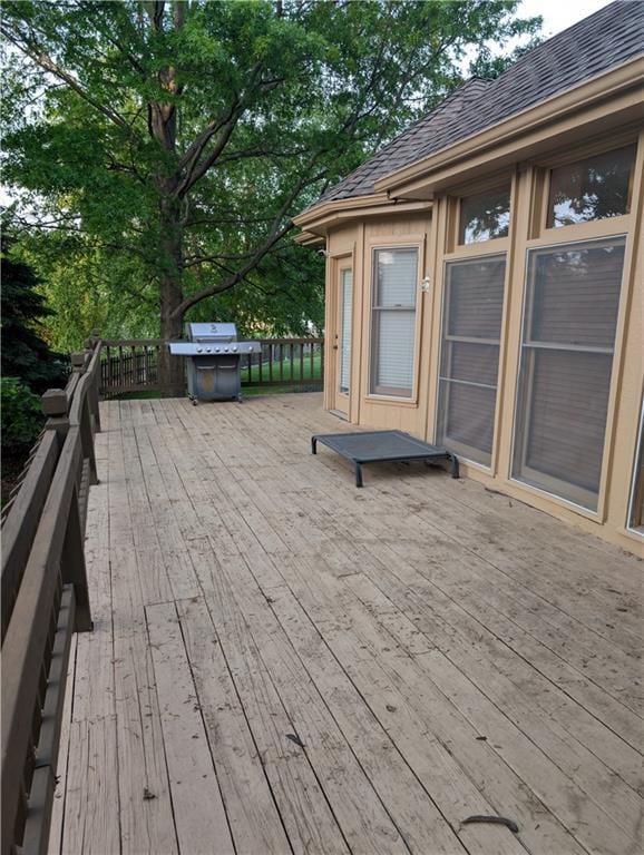 7730 N Shannon Ave, Kansas City, MO 64152 - wooden deck with a grill