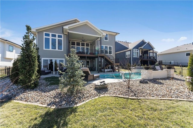 back of property with a patio area, stairway, ceiling fan, and fence