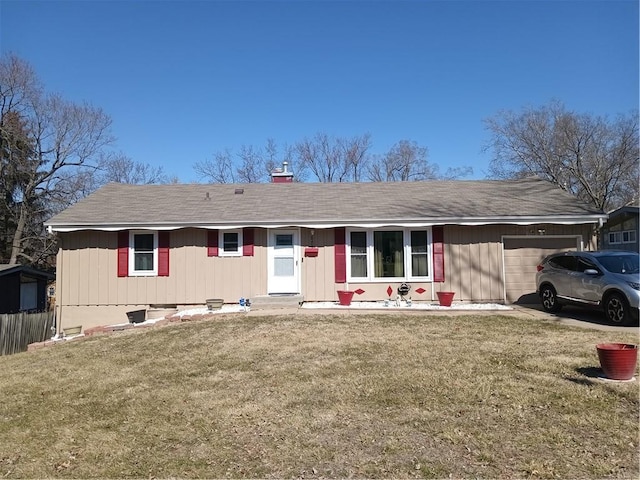 ranch-style home featuring an attached garage and a front lawn