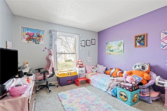 bedroom with carpet floors and a textured ceiling