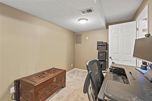 office area with baseboards, carpet, visible vents, and a textured ceiling