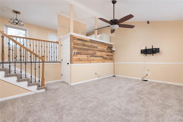 unfurnished living room featuring stairway, baseboards, ceiling fan, and carpet flooring