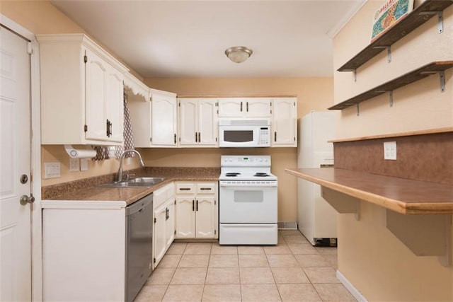 kitchen with a sink, open shelves, white appliances, and white cabinetry