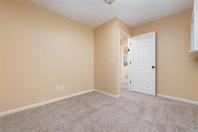 unfurnished bedroom with baseboards and carpet floors