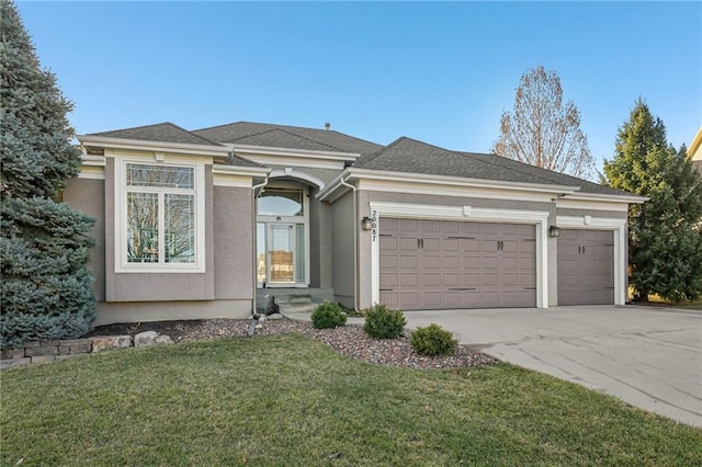 view of front of property featuring concrete driveway, roof with shingles, a front yard, stucco siding, and a garage