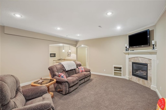 living area with arched walkways, recessed lighting, baseboards, and carpet floors