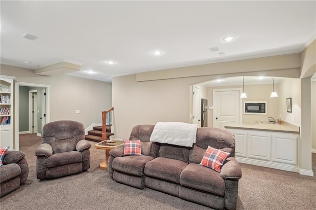 living area with baseboards, stairway, light carpet, recessed lighting, and arched walkways