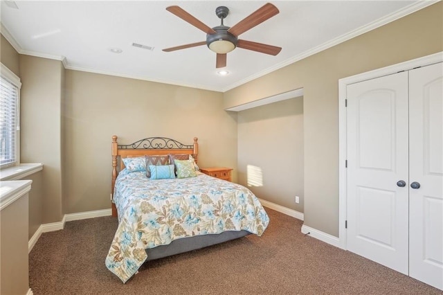 bedroom featuring crown molding, baseboards, and carpet floors