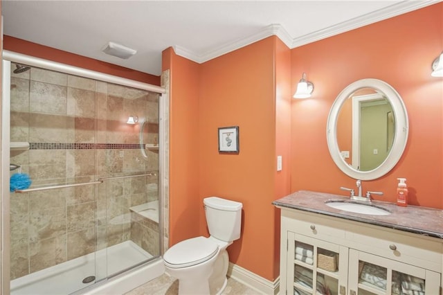 full bathroom featuring vanity, baseboards, a stall shower, crown molding, and toilet