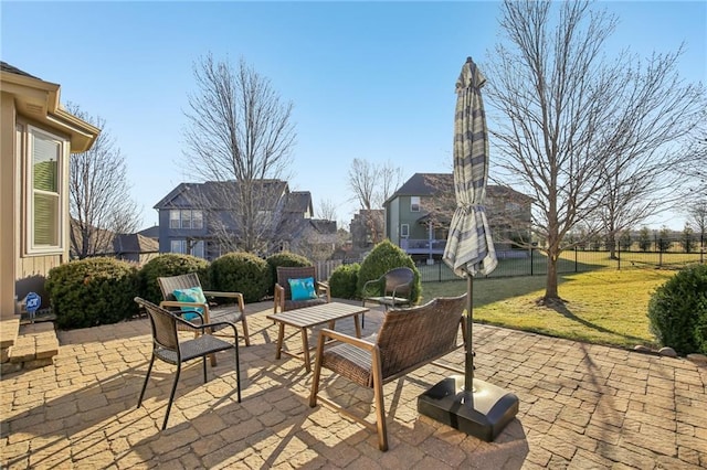 view of patio / terrace featuring fence