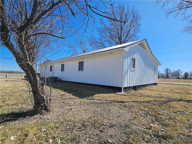 view of property exterior with metal roof