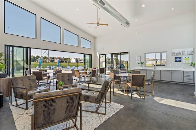 view of patio featuring outdoor dining area, visible vents, and ceiling fan