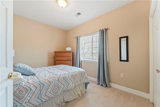 bedroom featuring carpet, visible vents, and baseboards