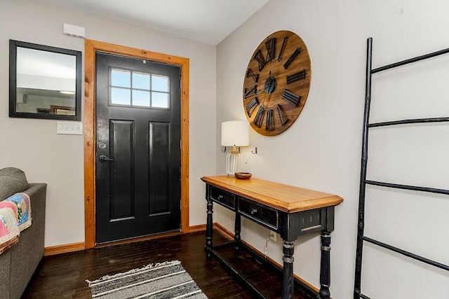 foyer entrance with baseboards and wood finished floors