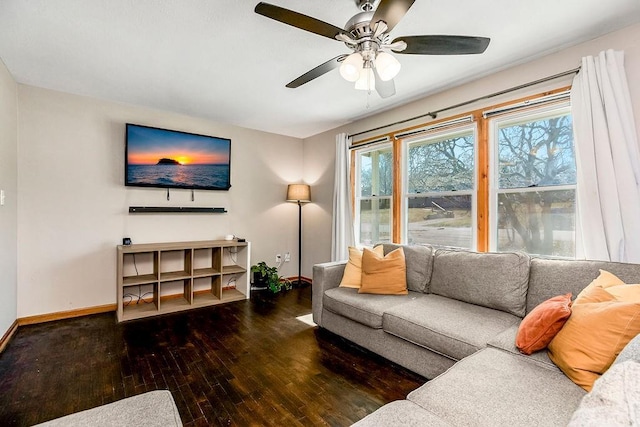 living room with baseboards, wood-type flooring, and ceiling fan