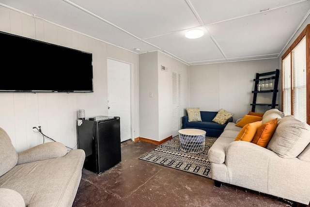 living room featuring visible vents and concrete flooring