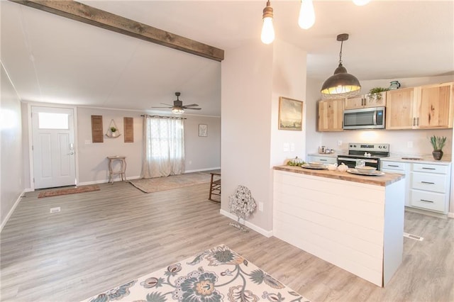 kitchen with light wood finished floors, light brown cabinets, vaulted ceiling with beams, baseboards, and stainless steel appliances