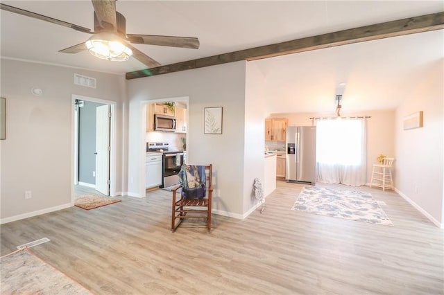 interior space featuring visible vents, light wood-style flooring, lofted ceiling with beams, baseboards, and ceiling fan